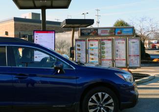Car in Wendy's Drive-Thru with customer talking to Wendy's FreshAI